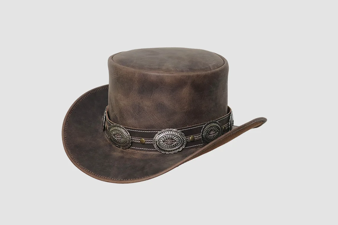 Distressed brown leather top hat with decorative concho band and vintage Western finish