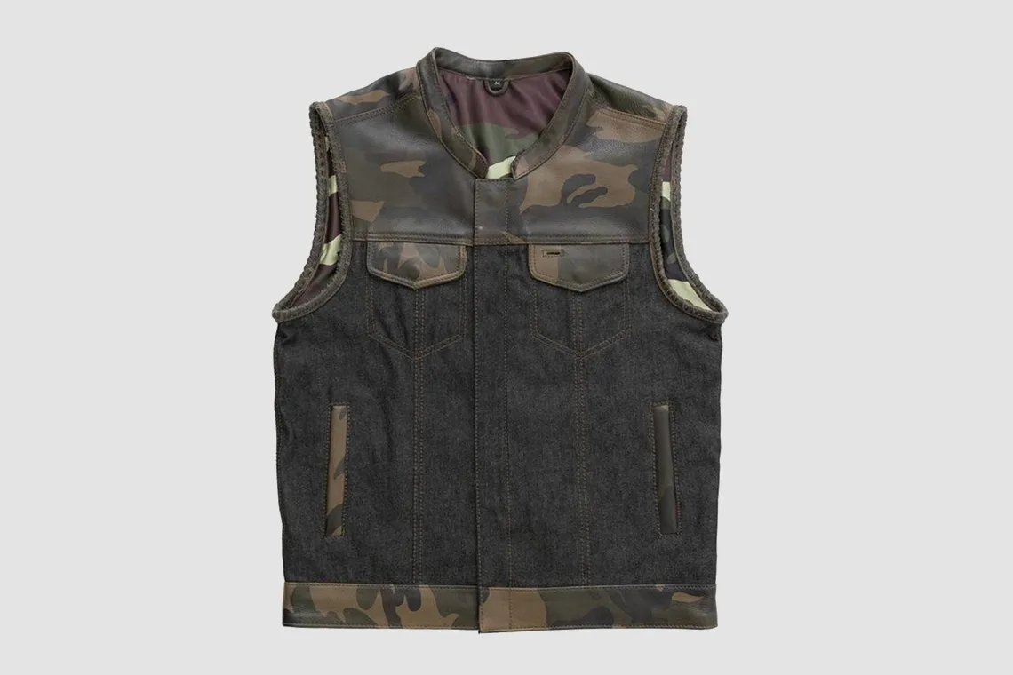 Men’s black denim vest with woodland camo leather panels and four pockets