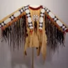 Women’s beaded suede war shirt with long dark hair trim and geometric beadwork