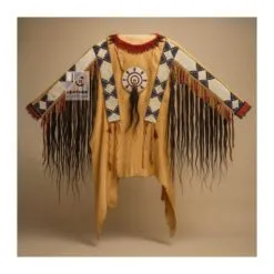 Man wearing brown suede western fringe shirt with beaded detailing and long fringe accents