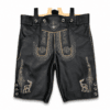 Front view of black premium leather lederhosen with traditional deer embroidery, decorative front flap, horn-style buttons, and authentic Bavarian craftsmanship on a studio white background.