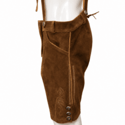Side view of brown men's suede lederhosen featuring a traditional knife pocket, decorative side embroidery, three horn-style buttons, and adjustable suspenders.