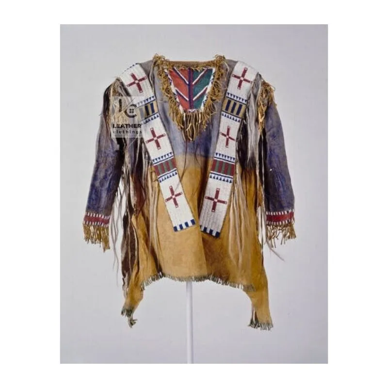 Woman wearing tan suede western fringe shirt with beaded detailing and fringe accents