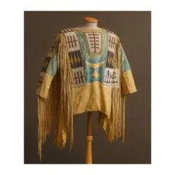 Woman wearing brown suede western fringe shirt with beaded detailing and fringe accents