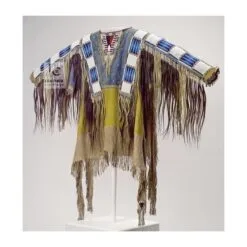 Woman wearing brown suede cowgirl fringe shirt with white and blue beadwork detailing