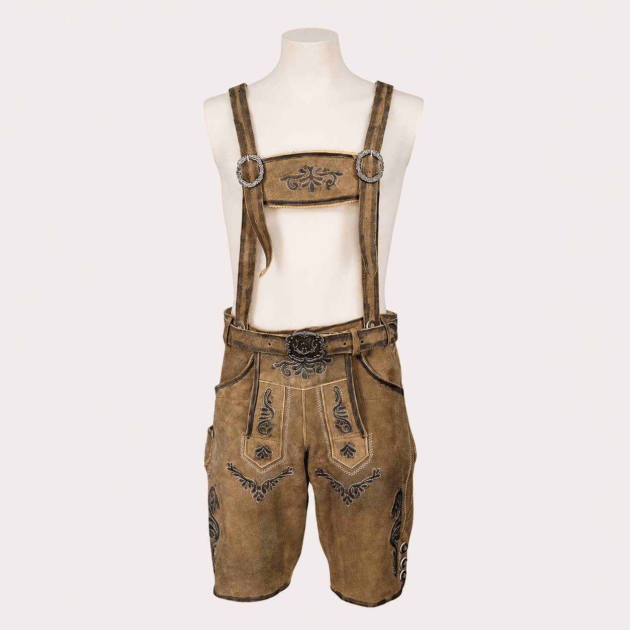 Men's Lederhosen with Suspenders in rustic tan genuine leather featuring embroidered flap, decorative belt buckle and traditional Bavarian design.