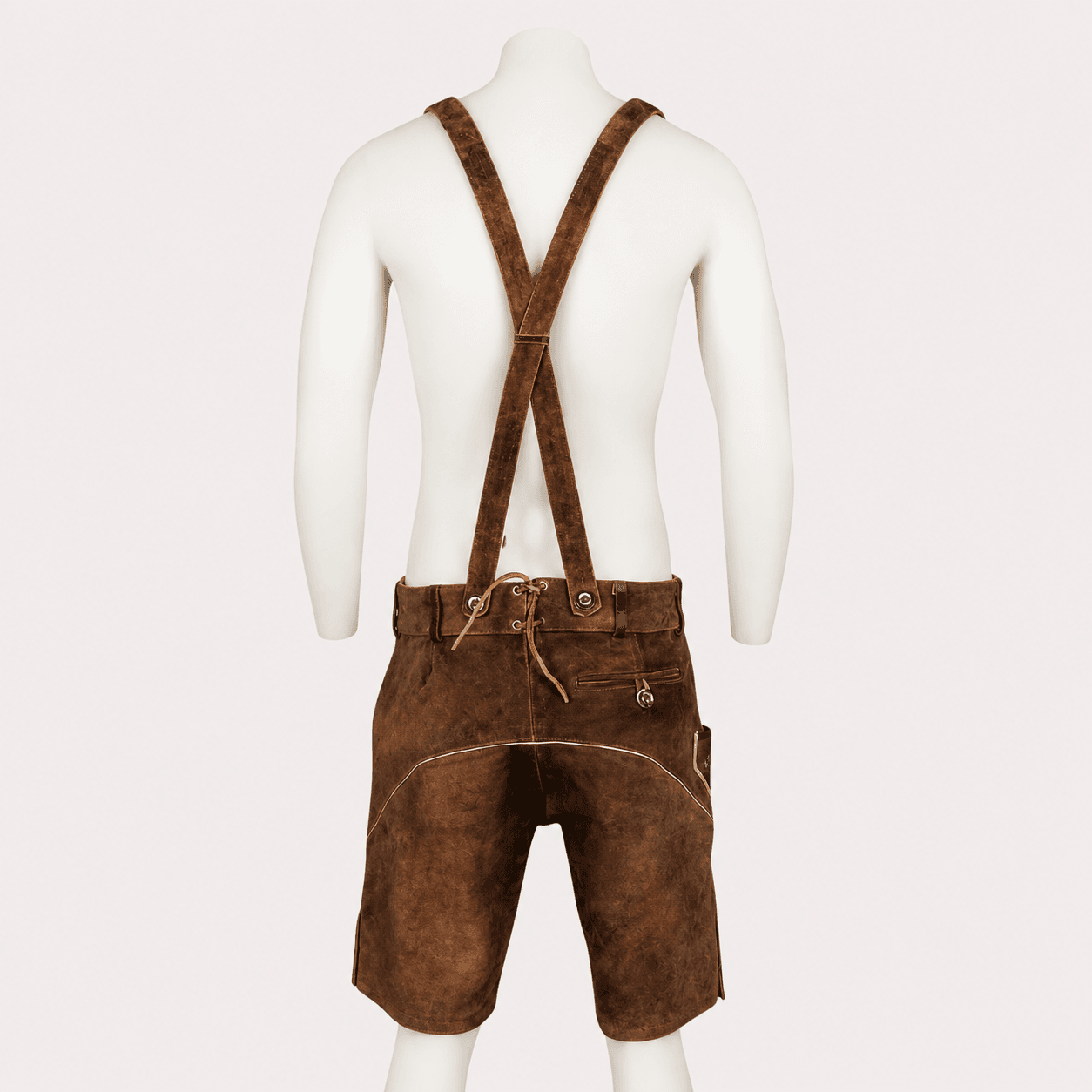 Men's Rustic Leather Lederhosen back view with crossed suspenders, rear lace adjustment, and buttoned back pocket in genuine brown leather.