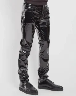 Black shiny PVC gothic pants featuring slim leg silhouette side view